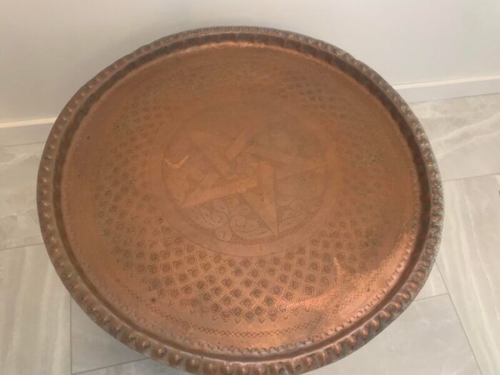 1960s moroccan hand worked copper tray with carved teak tripod base 2810