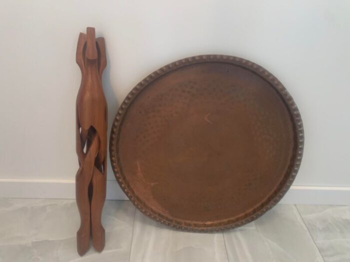 1960s moroccan hand worked copper tray with carved teak tripod base 5924