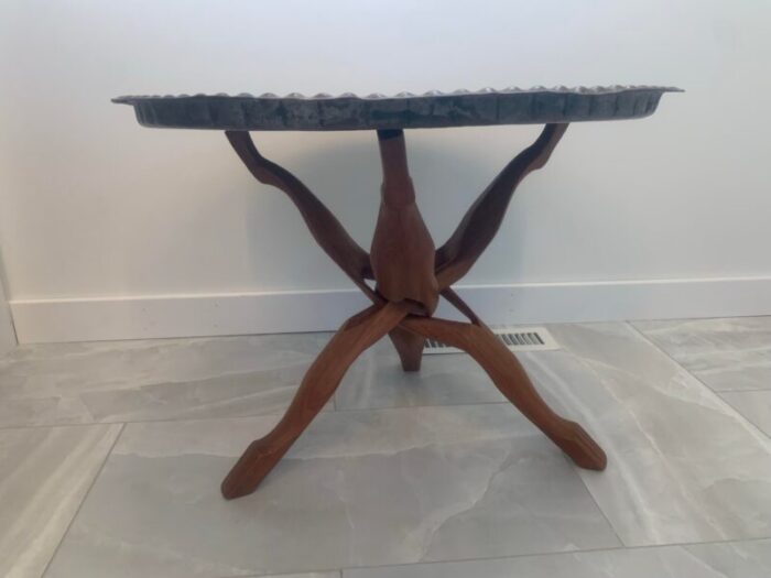 1960s moroccan hand worked copper tray with carved teak tripod base 7369