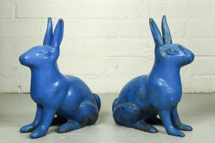 antique sculptural figural blue painted cast iron rabbit doorstops set of 2 2