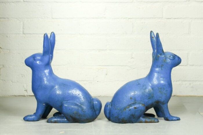 antique sculptural figural blue painted cast iron rabbit doorstops set of 2 3