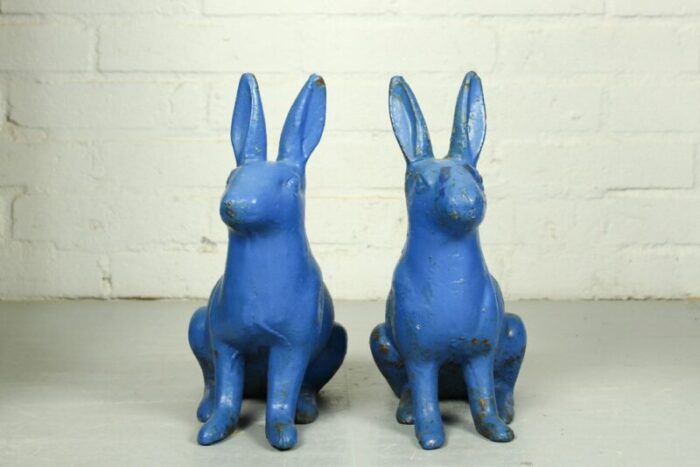 antique sculptural figural blue painted cast iron rabbit doorstops set of 2 4