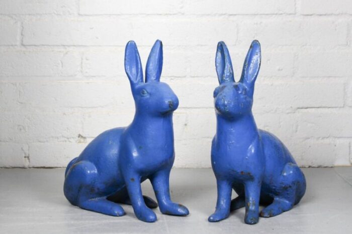 antique sculptural figural blue painted cast iron rabbit doorstops set of 2 5