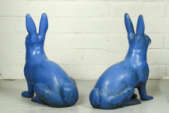 antique sculptural figural blue painted cast iron rabbit doorstops set of 2 7