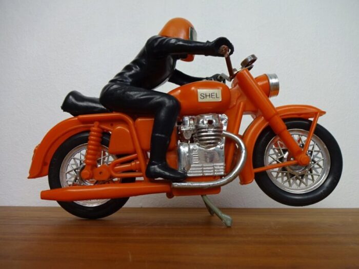 large vintage orange plastic motorcycle 1970s 1