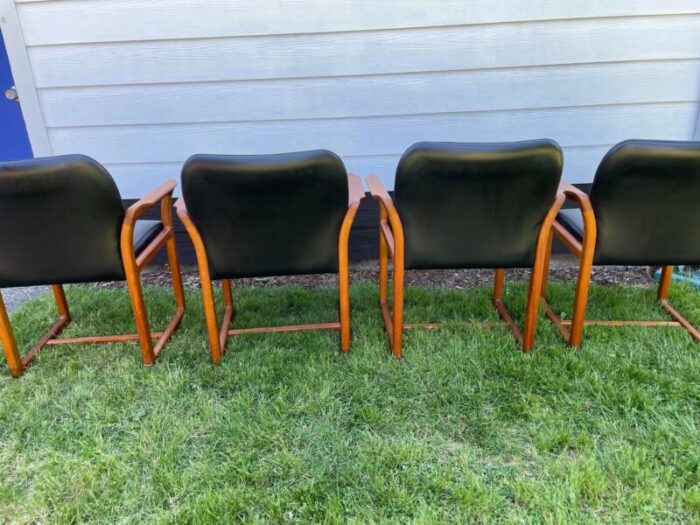 mid century danish modern teak and black leather dining arm chairs by benny linden set of 4 3401