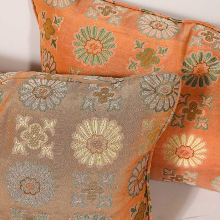 pair of silk and down stuffed pillows in orange and emerald green eastern patterning 3781