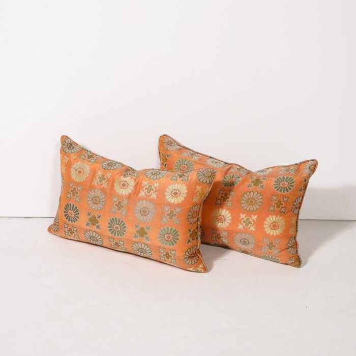 pair of silk and down stuffed pillows in orange and emerald green eastern patterning 7474